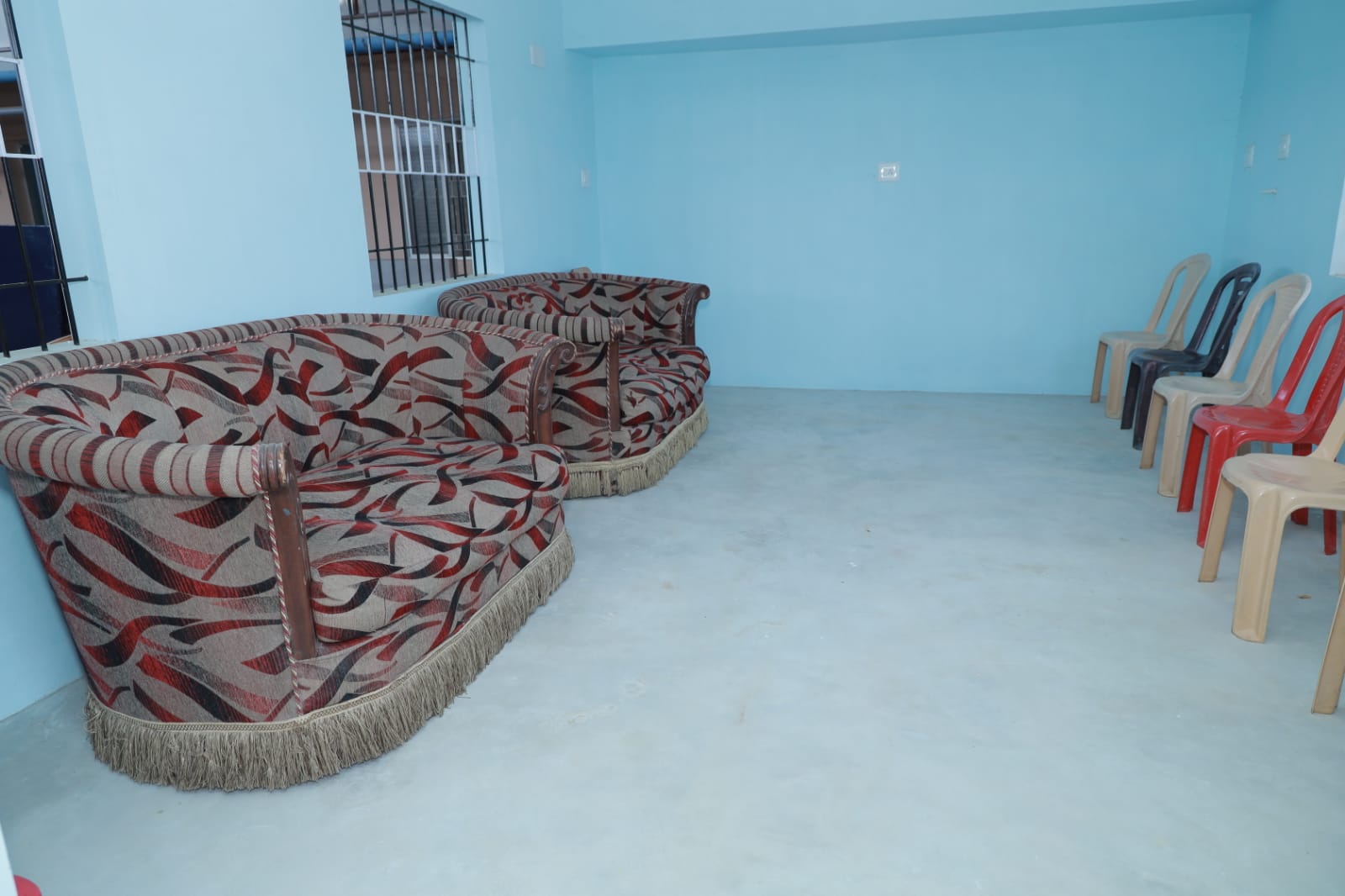 Peaceful resident living lounge with cushioned sofas