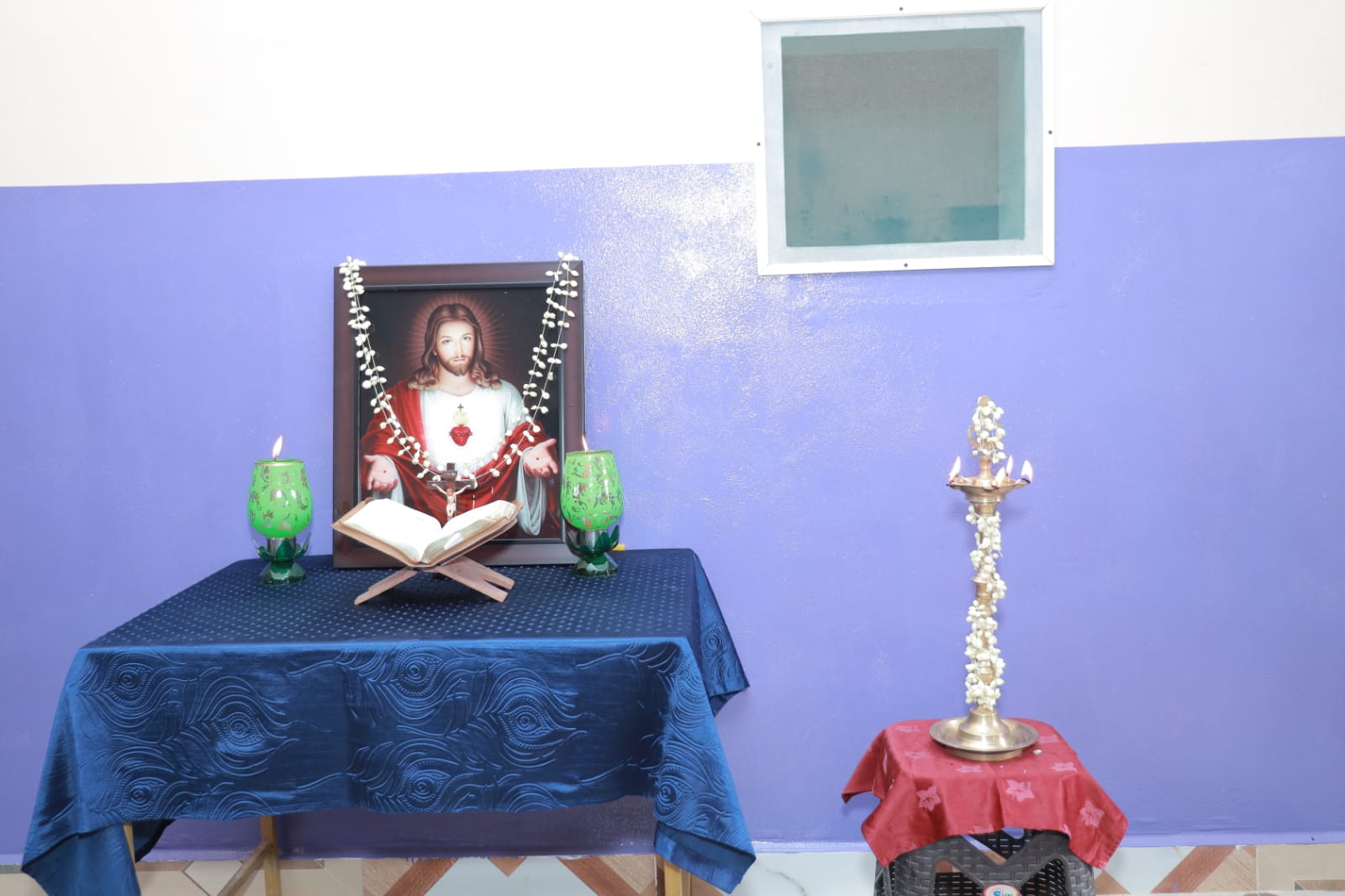 Spiritual prayer chapel altar with Sacred Heart portrait and brass oil lamp