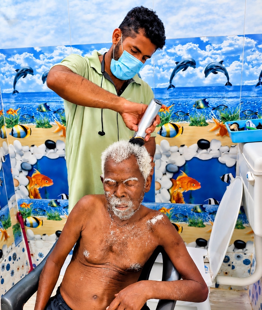 Dedicated caregiver providing personal grooming and haircut
